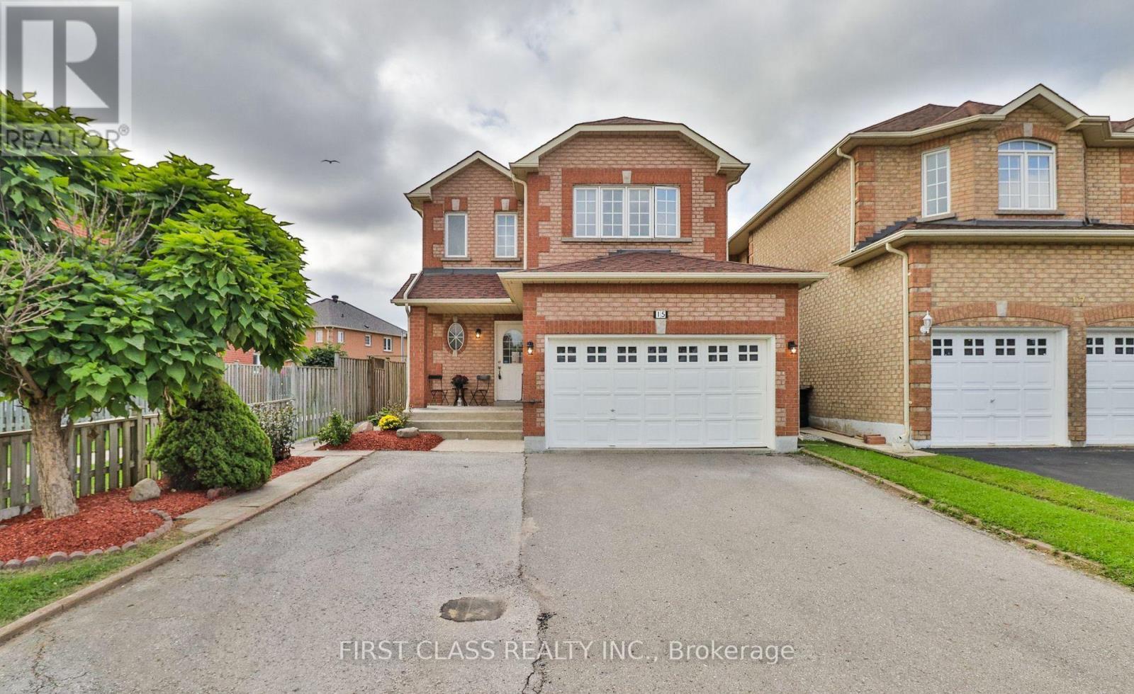A large brick house with a garage is for sale.