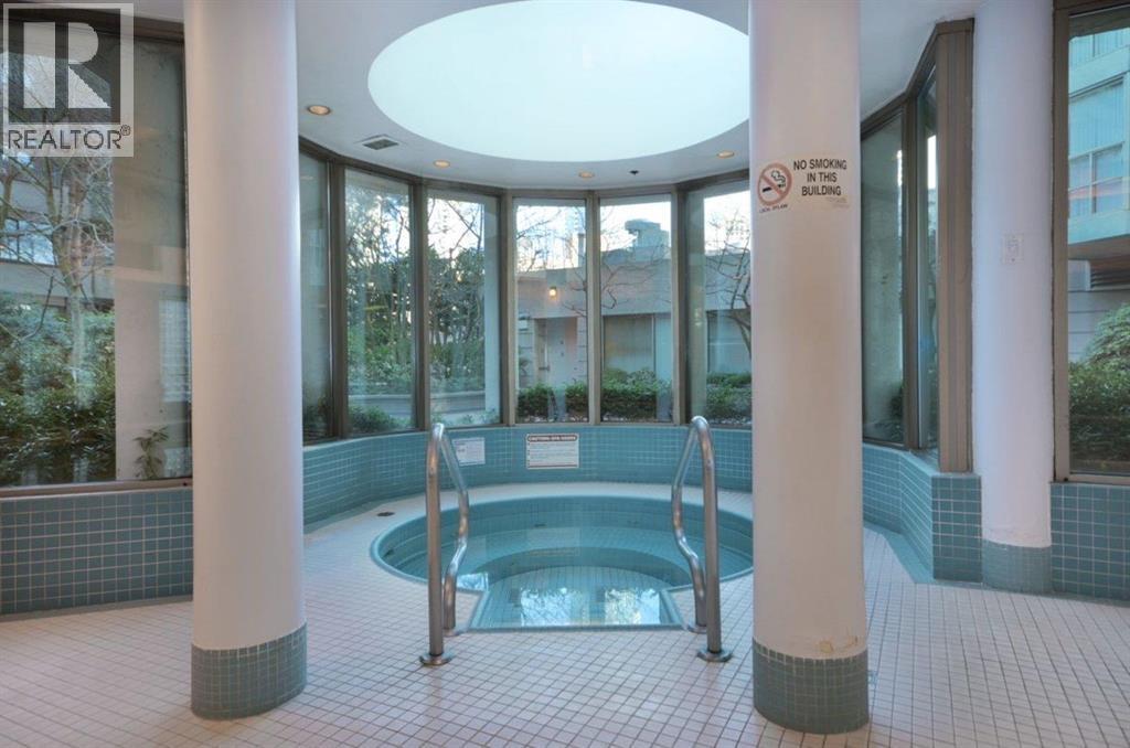 A pool area with a sign that says "No Diving in this Building".