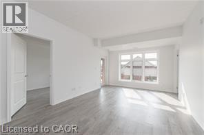 A room with a doorway leading to another room.