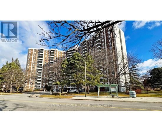 A street view of a residential area with apartment buildings and a sign for Central Home Realty Inc.