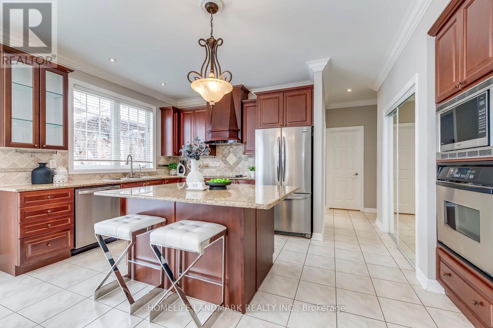 A kitchen with brown cabinets and a white countertop.