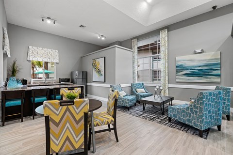 A living room with a dining table and chairs.