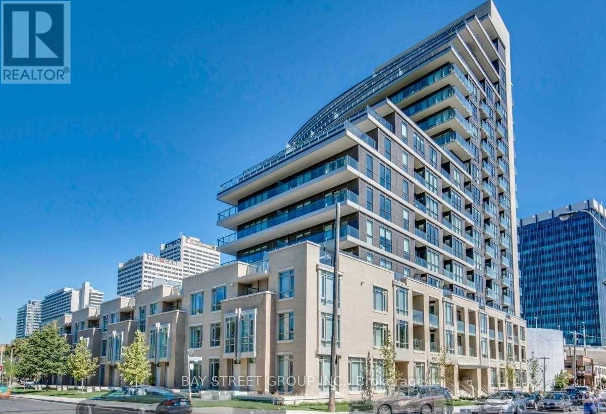 A modern multi-story building with the words "Bay Street Group" on the front.