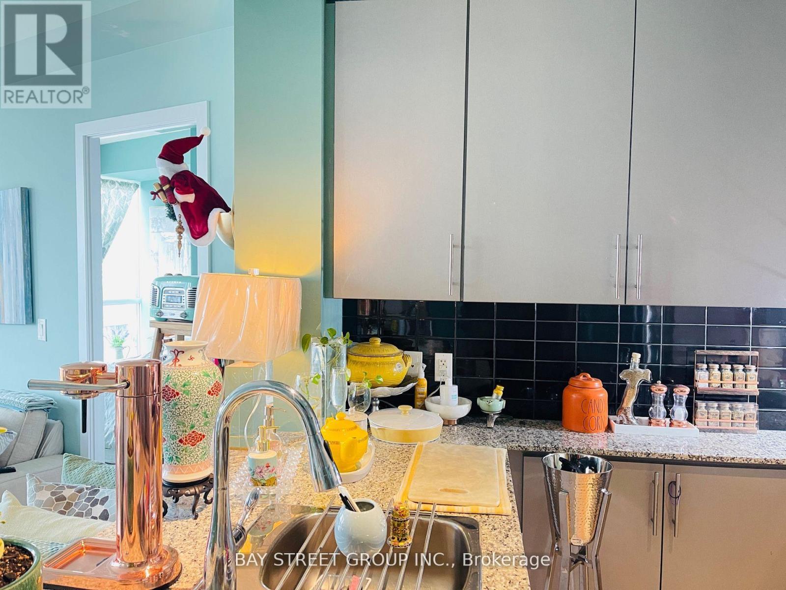 A kitchen with a sink and a window.