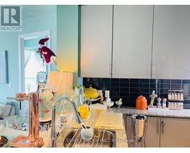 A kitchen with a sink and a window.