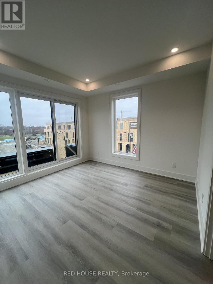 A room with a large window and a view of a building.