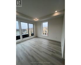 A room with a large window and a view of a building.