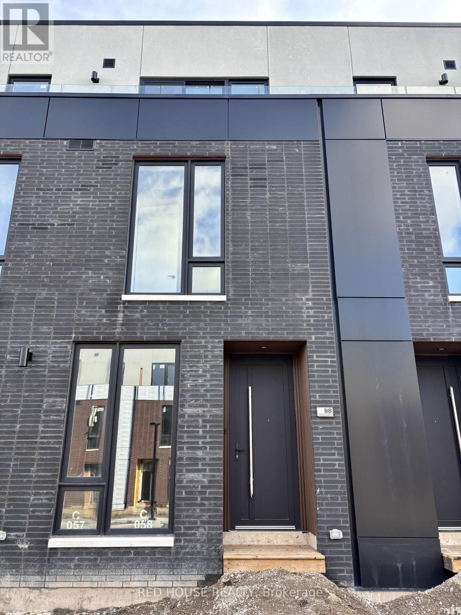 A modern building with a black door and windows.