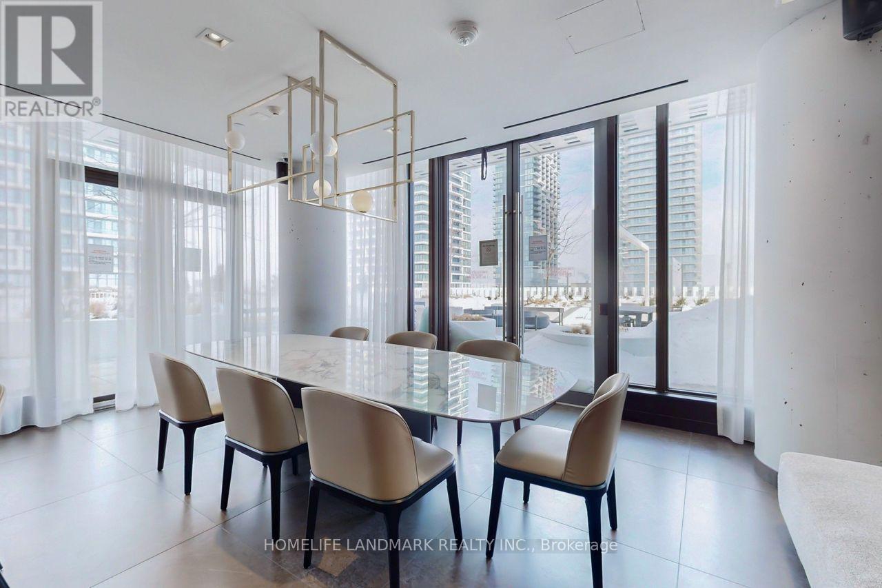 A dining room with a glass table and chairs.