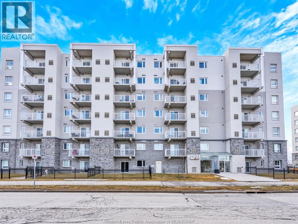 A large apartment building with a sign that says REALTOR.