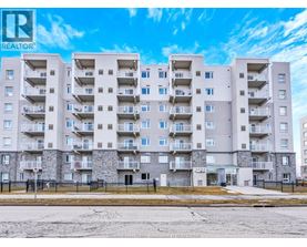 A large apartment building with a sign that says REALTOR.