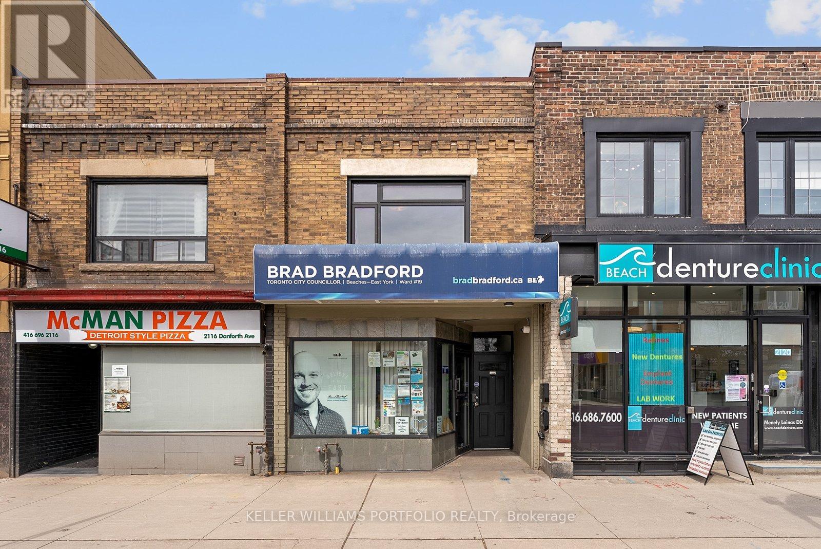 A building with a Brad Breaderorp sign on it.
