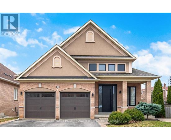 A two-story house with a garage and a driveway.