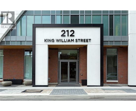 The front of a building with a glass facade and a sign that reads "212 King William Street.".