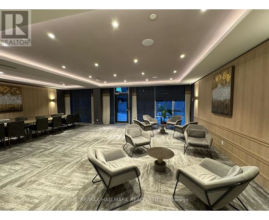 A spacious waiting area with comfortable seating and a carpeted floor.
