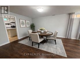A dining room with a table set for four.