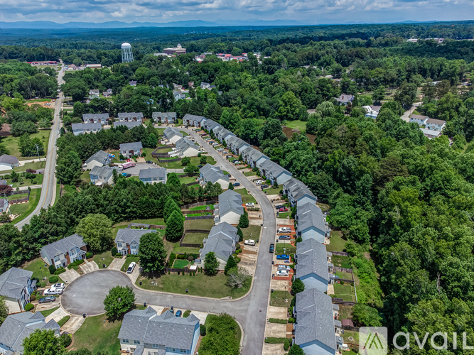 A bird's eye view of a residential area with houses and trees.