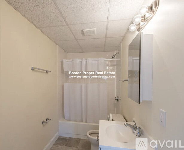 A bathroom with a sink, toilet, and shower.