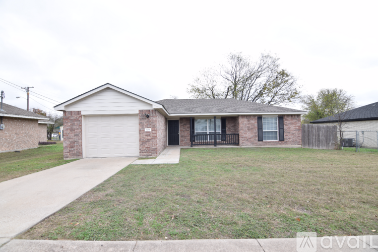 A house with a garage is for sale.