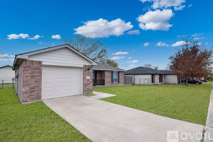 A house with a brick exterior and a white door is available for rent.