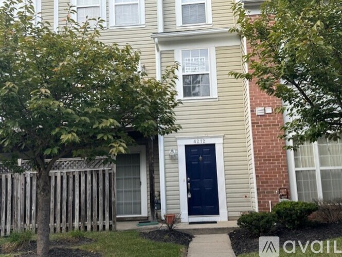 A house with a blue door and a white front porch.