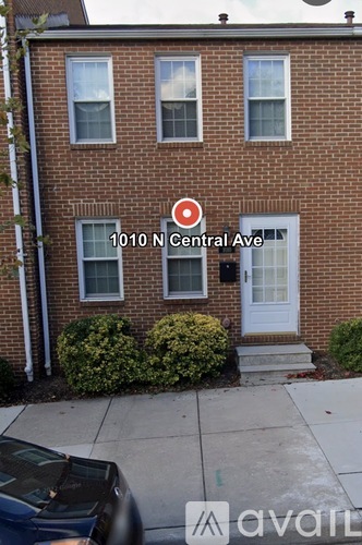 A brick house with a sign that says 1010 N Central Ave.