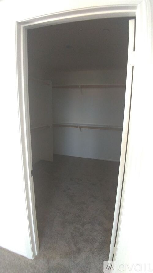 A white refrigerator with its door open.