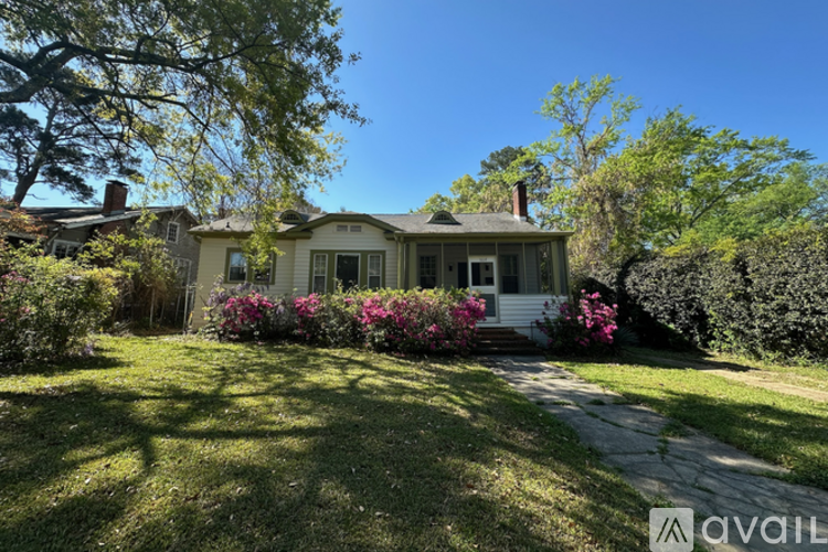 A house with a front yard and a driveway.
