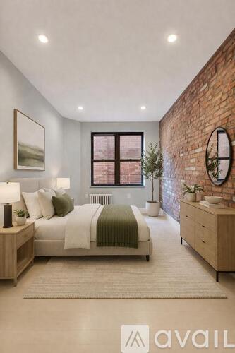 A bedroom with a bed, nightstand, and a plant.
