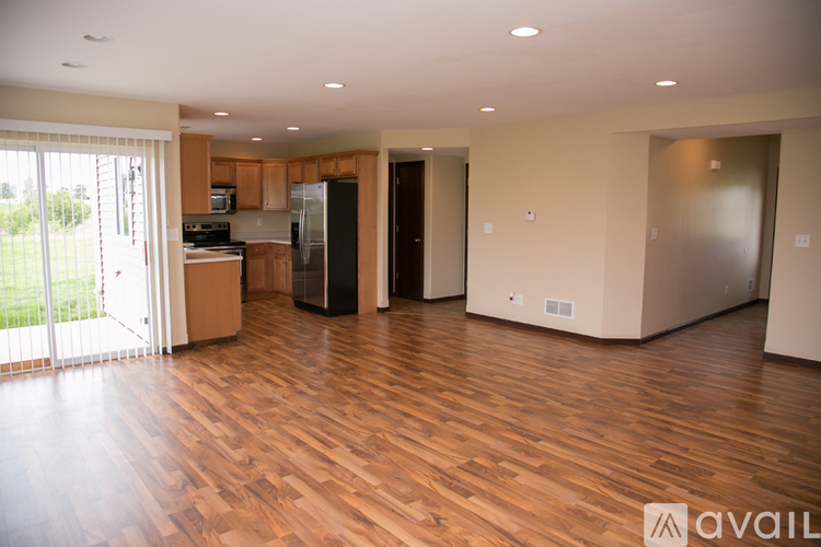 A kitchen area with a refrigerator, microwave, and oven.