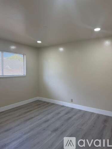 A room with a window and Avail logo on the floor.