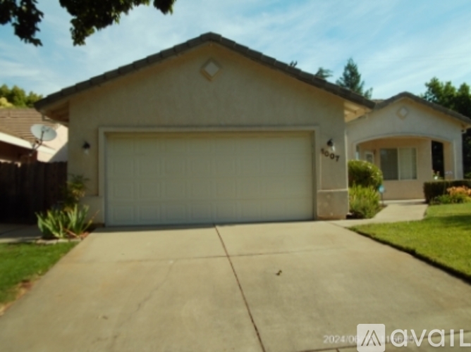 A house with a garage door that is closed.