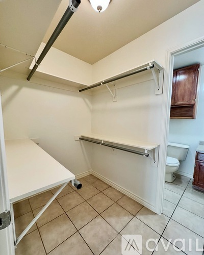 A white bathroom with a toilet and a sink.
