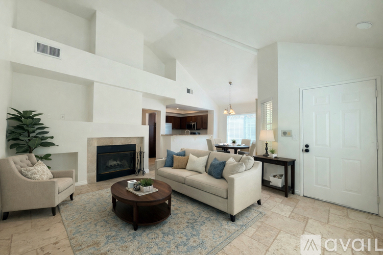 A living room with a fireplace and a couch.