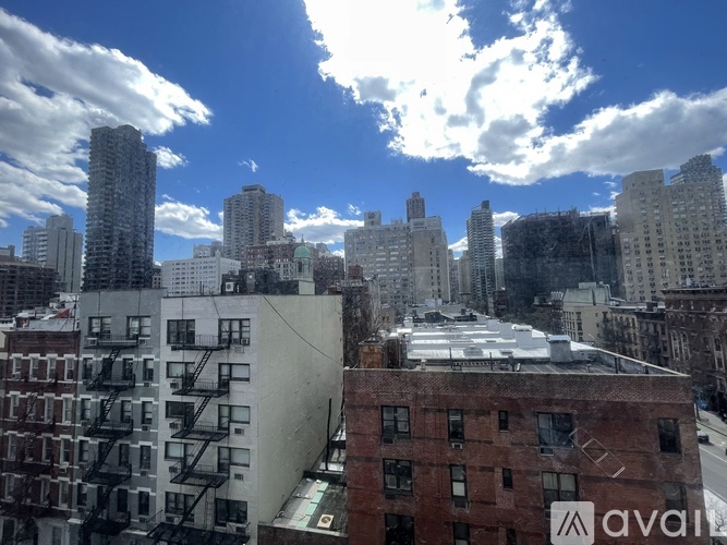 A cityscape with buildings and a clear sky.