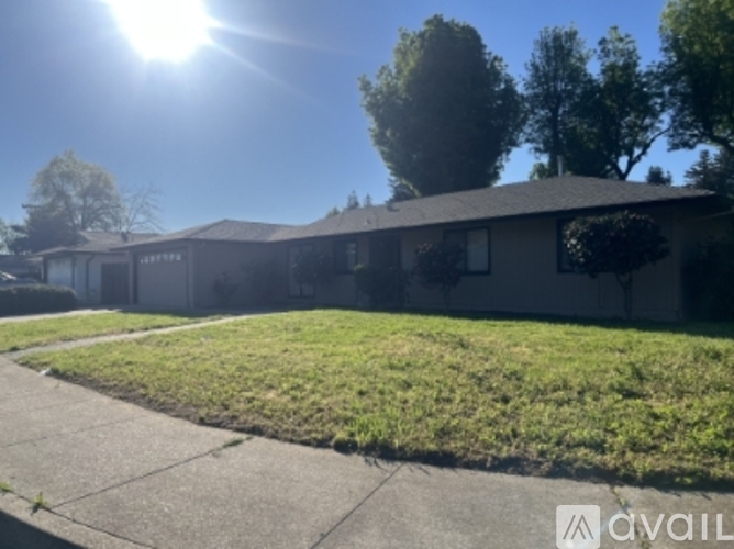 A house with a lawn in front of it is available for sale.