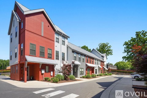 A red and white building with a clear blue sky in the background.