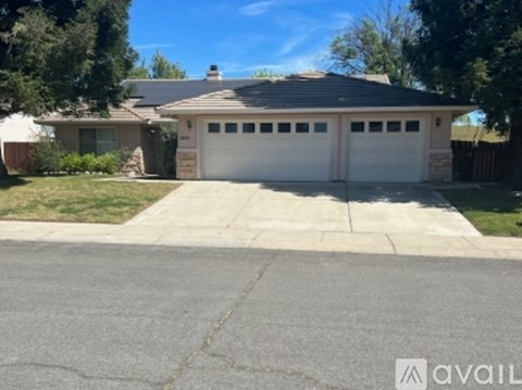 A house with a garage is available for sale.