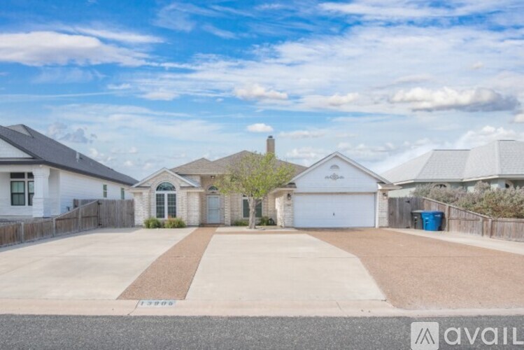 A house with a driveway in front of it is for sale.