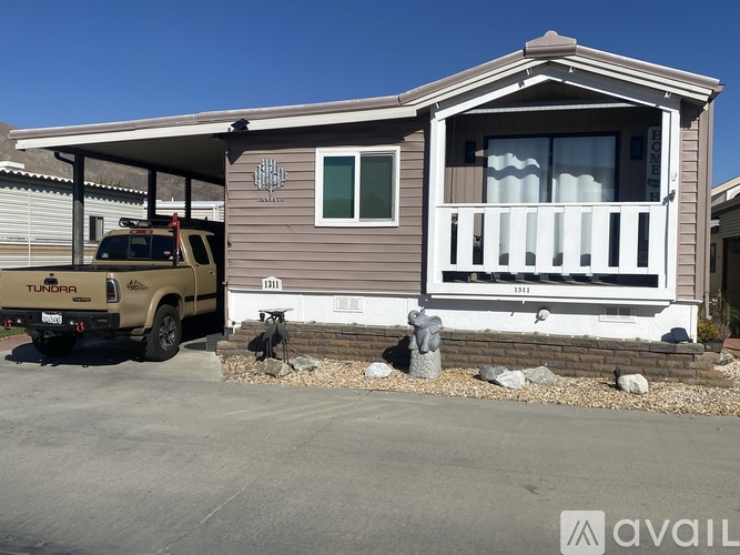 A house with a Tundra truck parked in front.