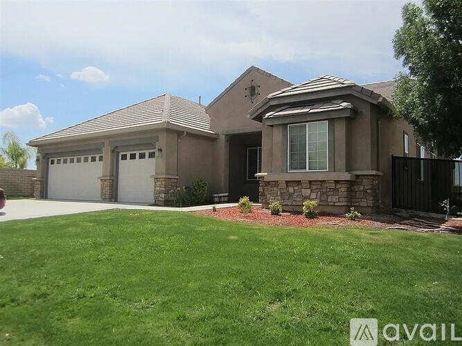 A house with a garage and a driveway.