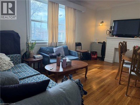 A living room with a blue couch and a wooden coffee table.