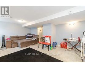 A living room with a couch, chair, and a rug.