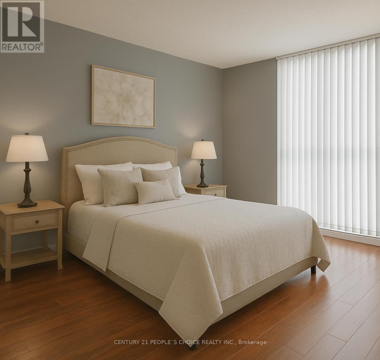 A bedroom with a large bed and two lamps.