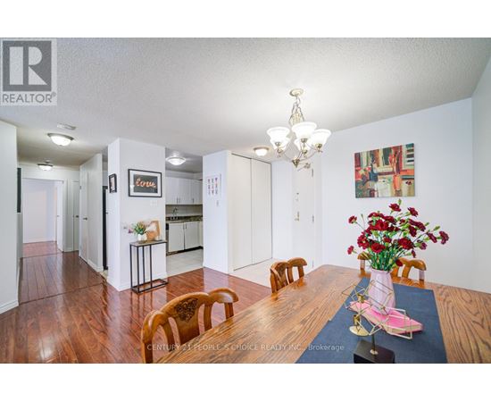 A kitchen with white cabinets and a black stove top oven.