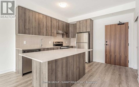 A modern kitchen with wooden cabinets and a white countertop.