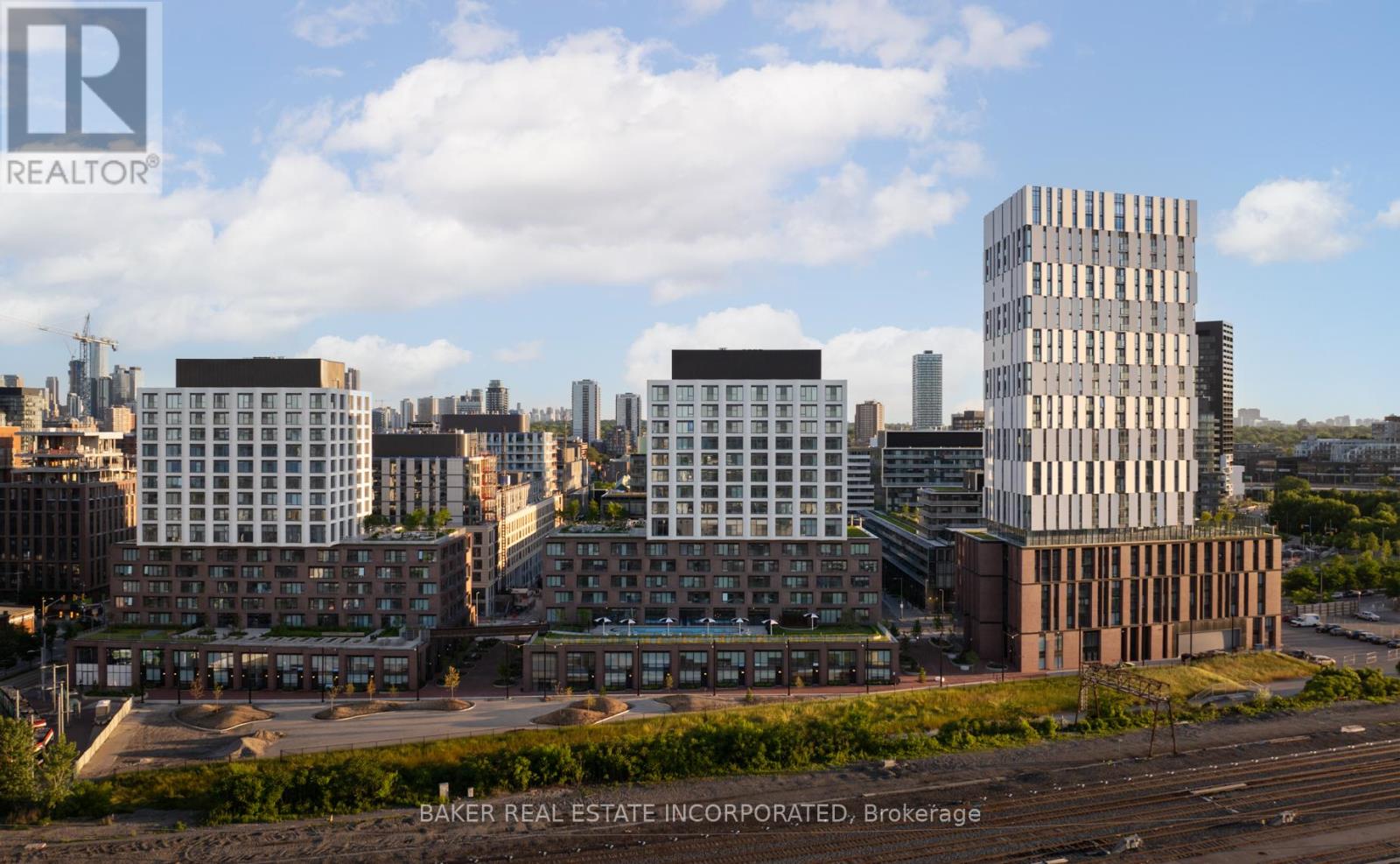 A cityscape with buildings and a clear sky.