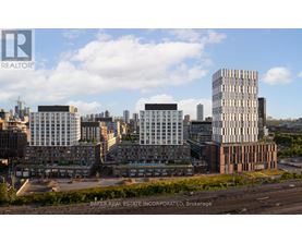 A cityscape with buildings and a clear sky.