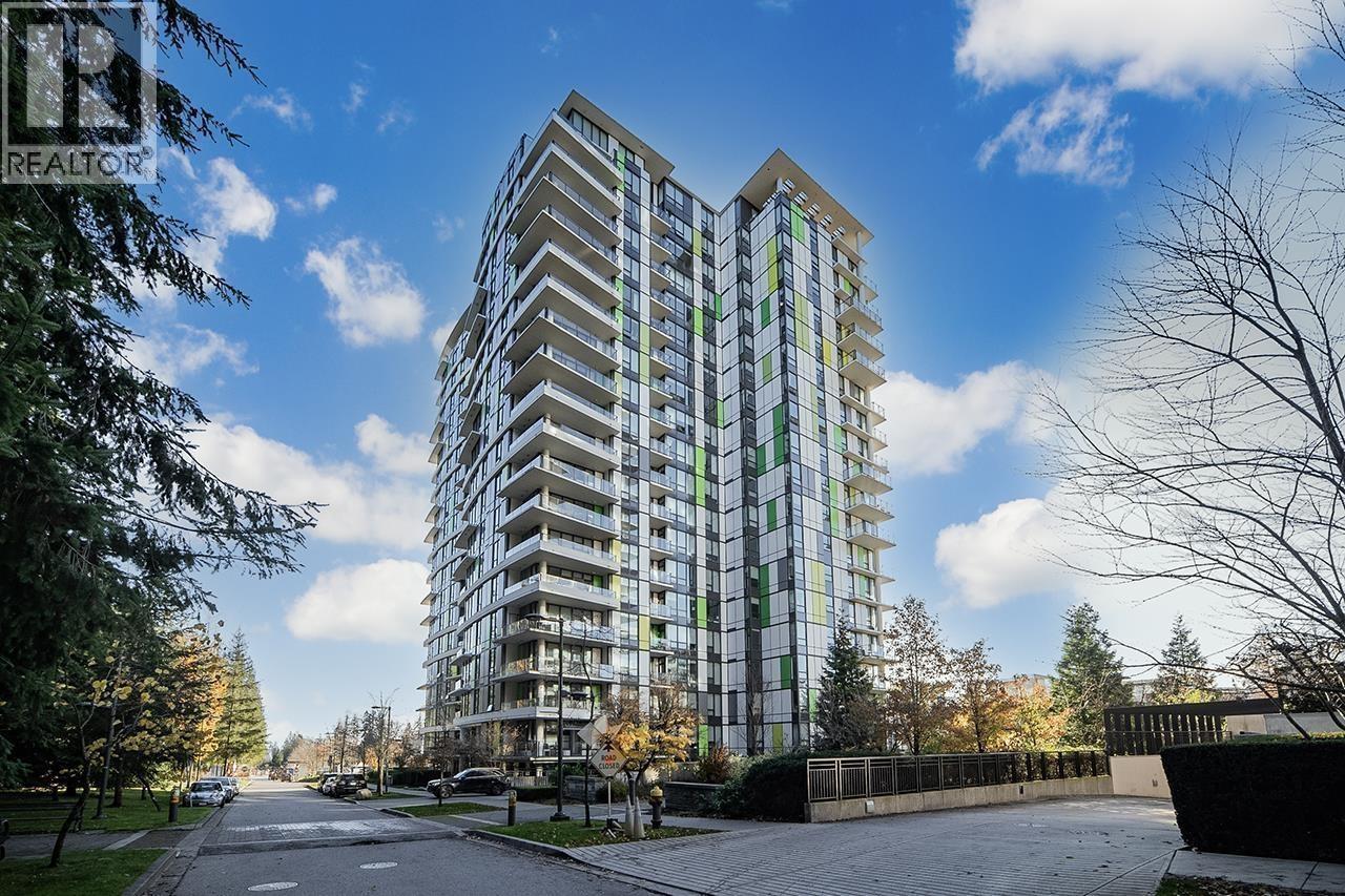 A tall residential building with balconies on the 10th floor and above.