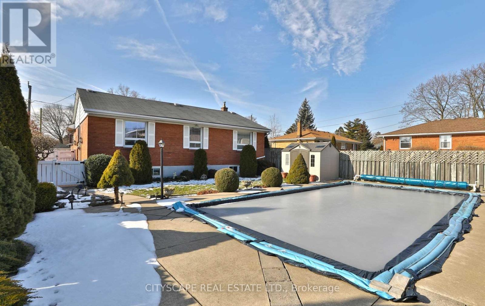 A house with a swimming pool in the backyard.